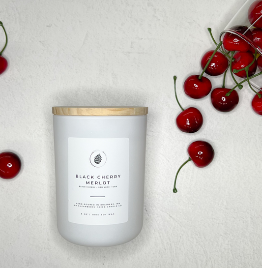 Black Cherry Merlot Cndle with cherry falling from a wine glass