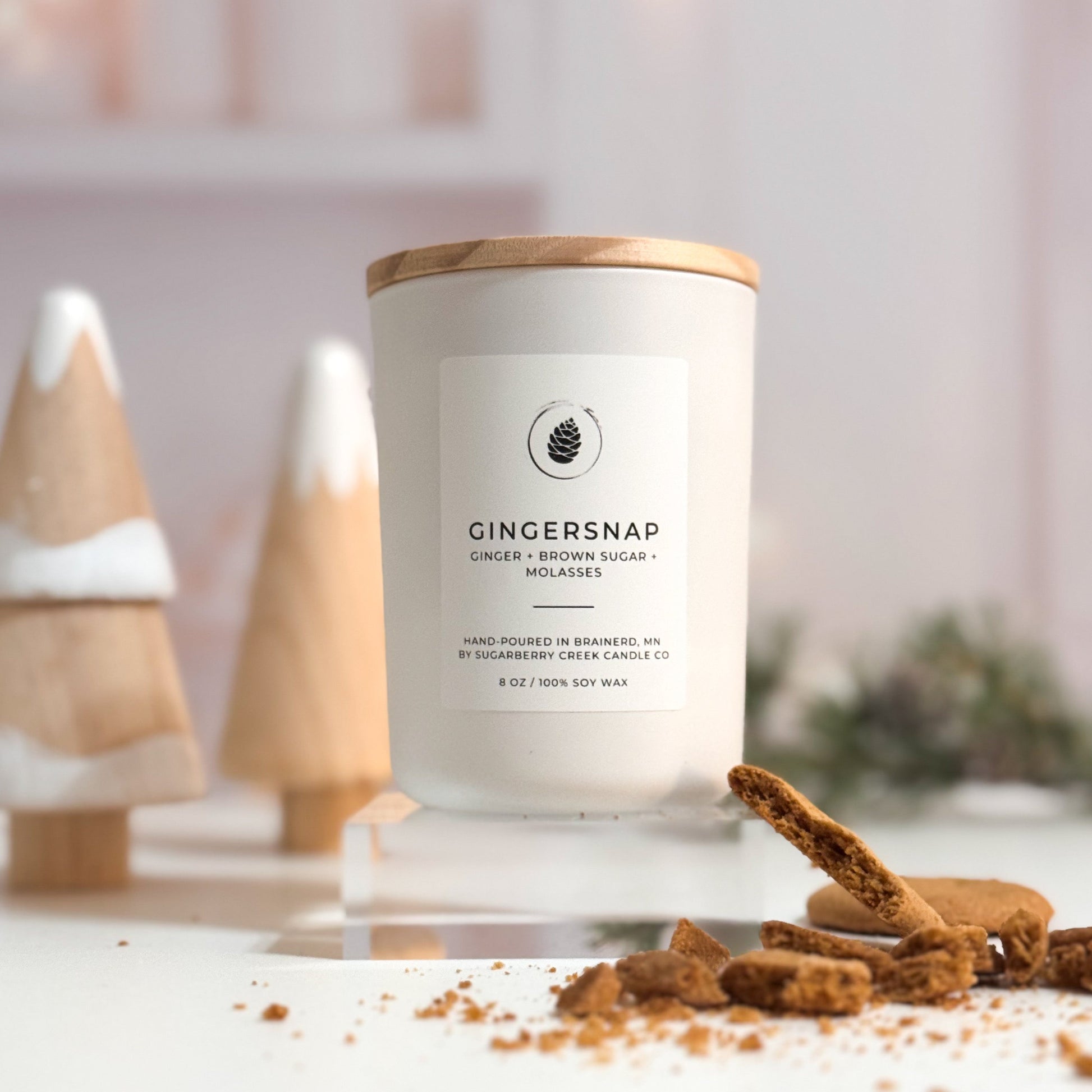 Gingersnap candle with decorative elements on a white surface