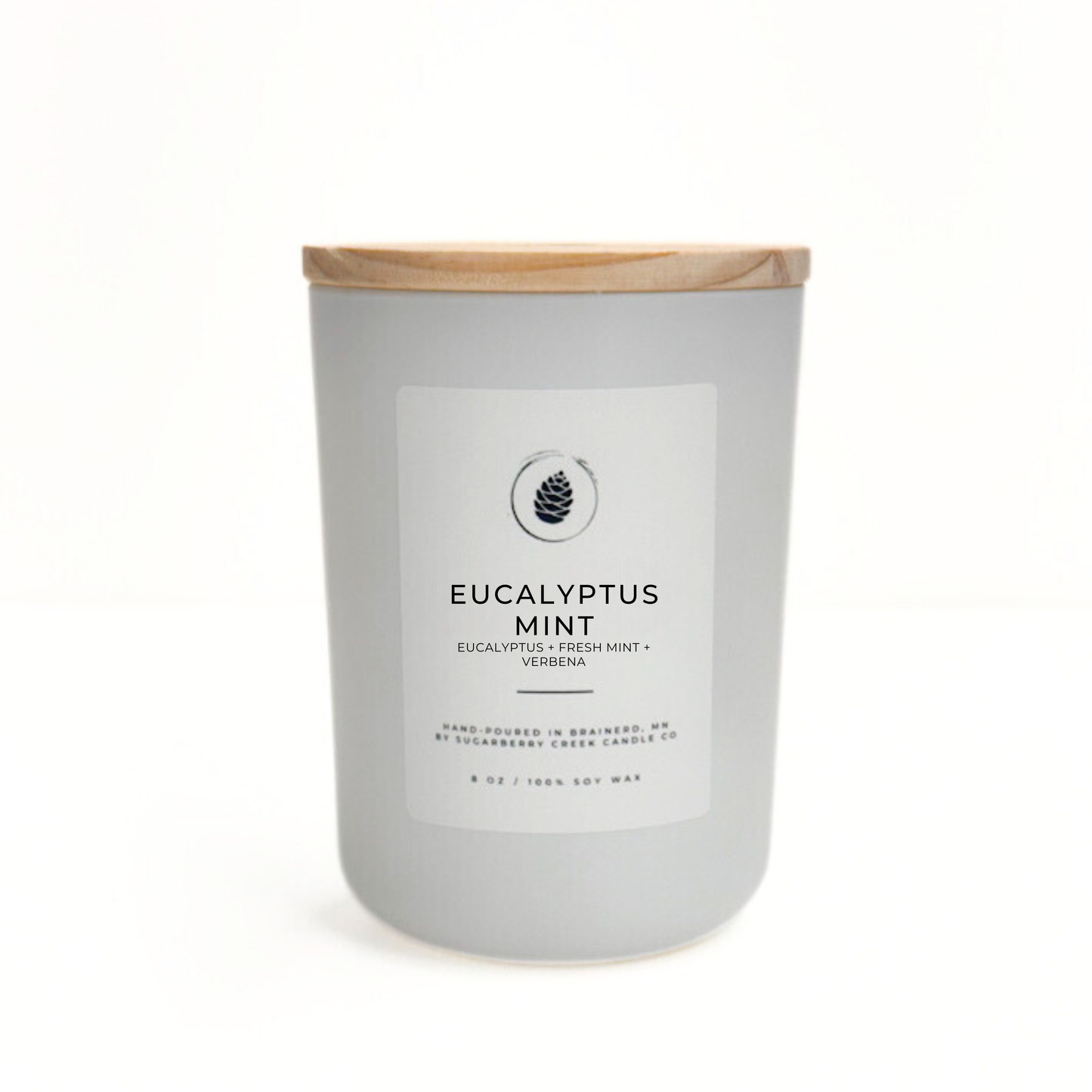 Candle with eucalyptus mint fragrance on a white background