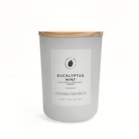 Candle with eucalyptus mint fragrance on a white background