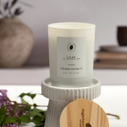 Lilac candle on pedestal