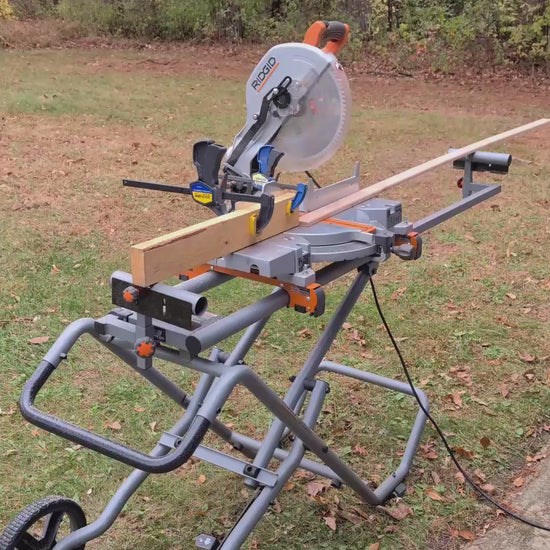 Man in green and black plaid shirt cutting wood into blocks and routing the edges.