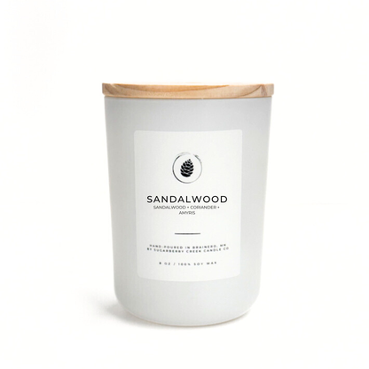 Sandalwood candle with a wooden lid on a white background