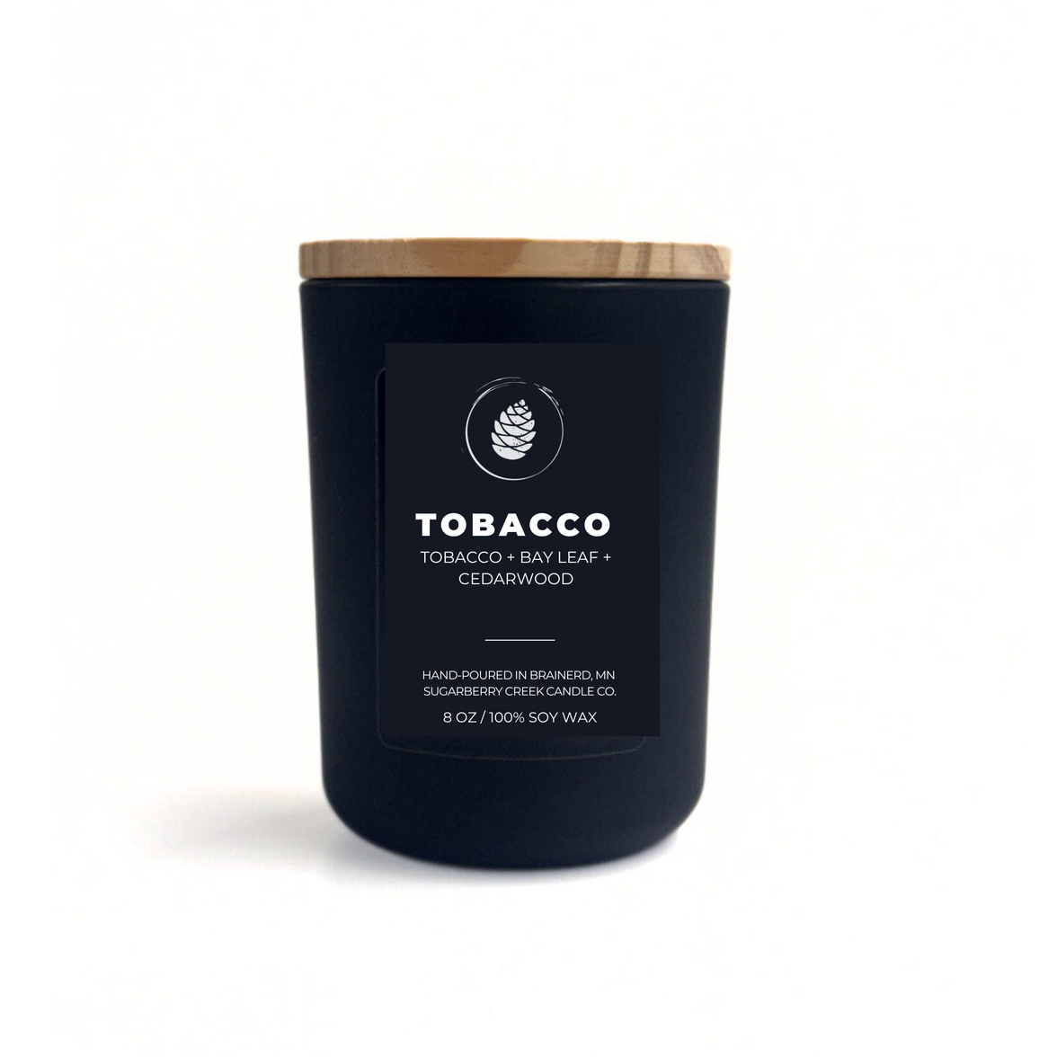 Black candle with a wooden lid labeled 'Tobacco' on a white background