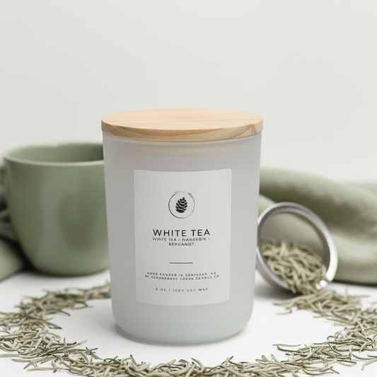 White tea candle with wooden lid on a white background